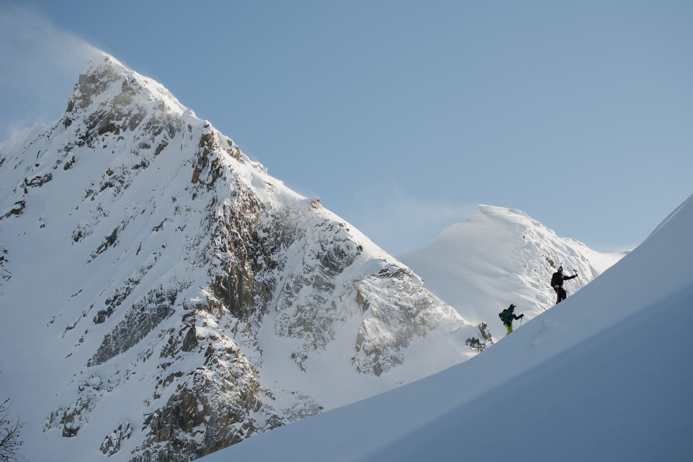 BALANCING ACT: Leah Evans and Seb Barlerin ascend the Jumbo Pass ridgeline, bearing north towards the Strabird and Jumbo Glaciers. Part of the Central Purcells, this massif is the geographical divide between the East and West Kootenay, as well as Jumbo and Glacier Creeks.