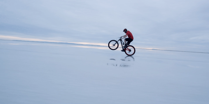 mountain biker on beach in Oregon